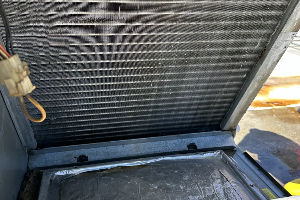 Cleaned evaporator coil and drain pan with the panel open