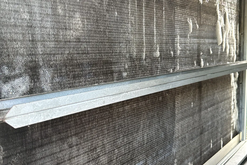 Cleaning foam applied to an evaporator coil face