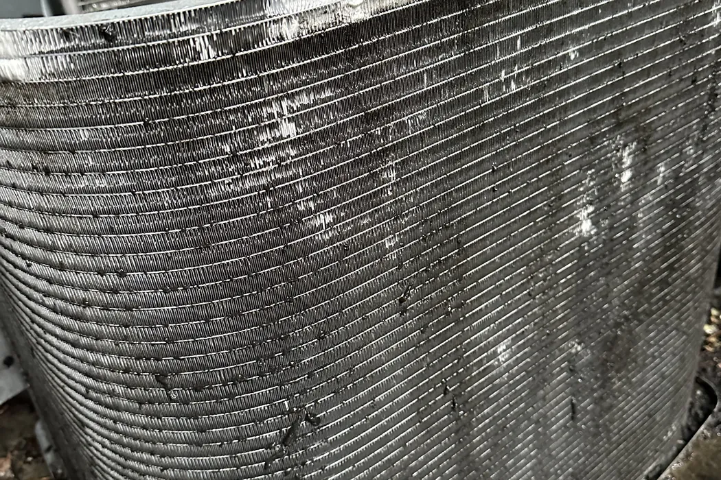 Condenser coil fins wet and clear after rinsing