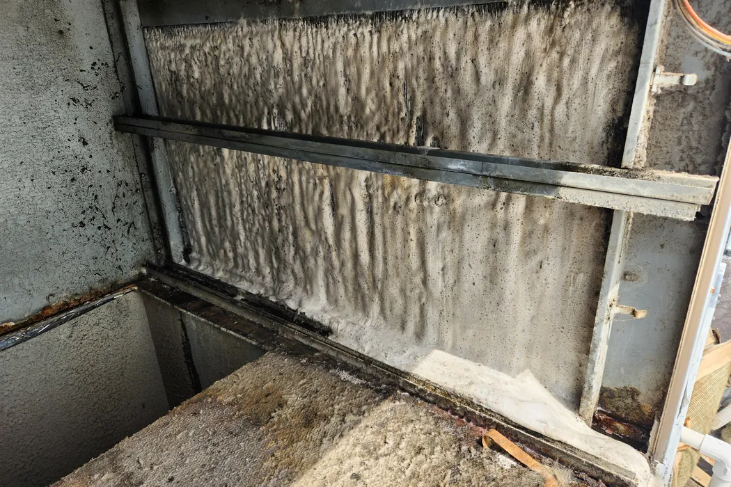Cleaning foam covering a rooftop unit coil